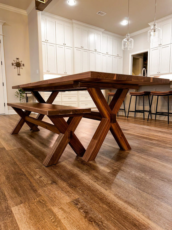 Eight-foot walnut dining table with bench and chairs