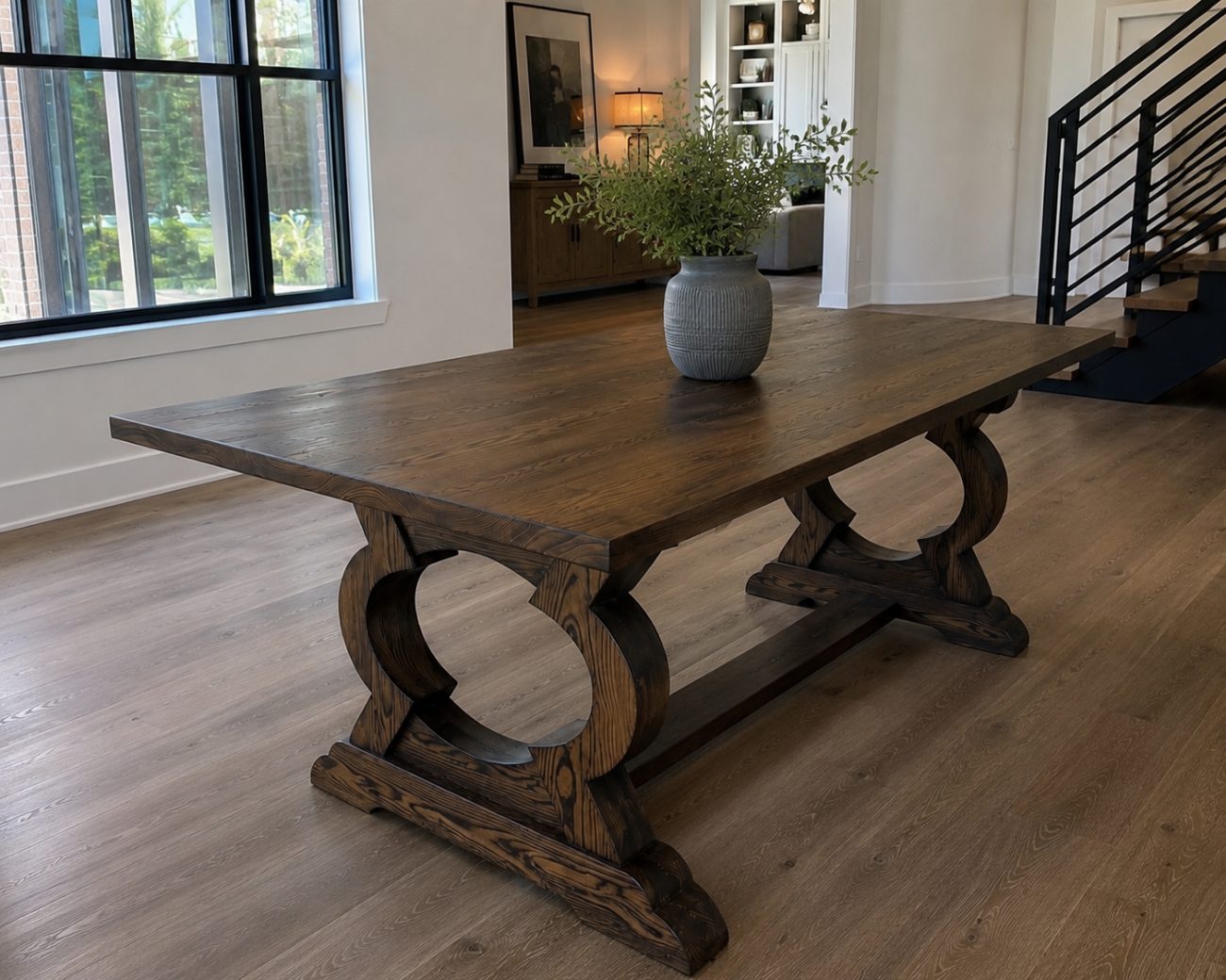 Rectangular white-oak dining table on a sculpted circle-base trestle